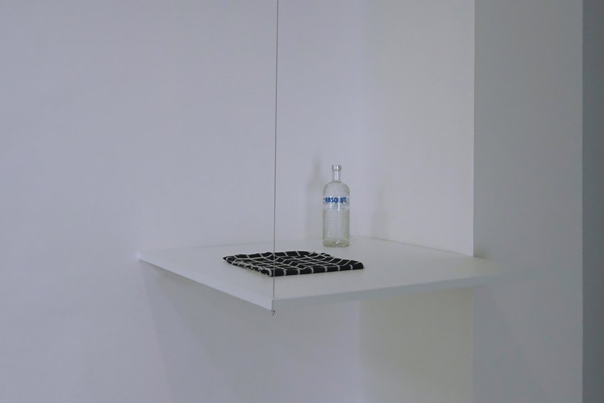 Sean Snyder Duty-Free Molotov Cocktail, 2015-2016 Scarf and vodka on 101 cm x 101 cm x 3 cm PVC support, RAL 9010, supended at height of 120 cm 