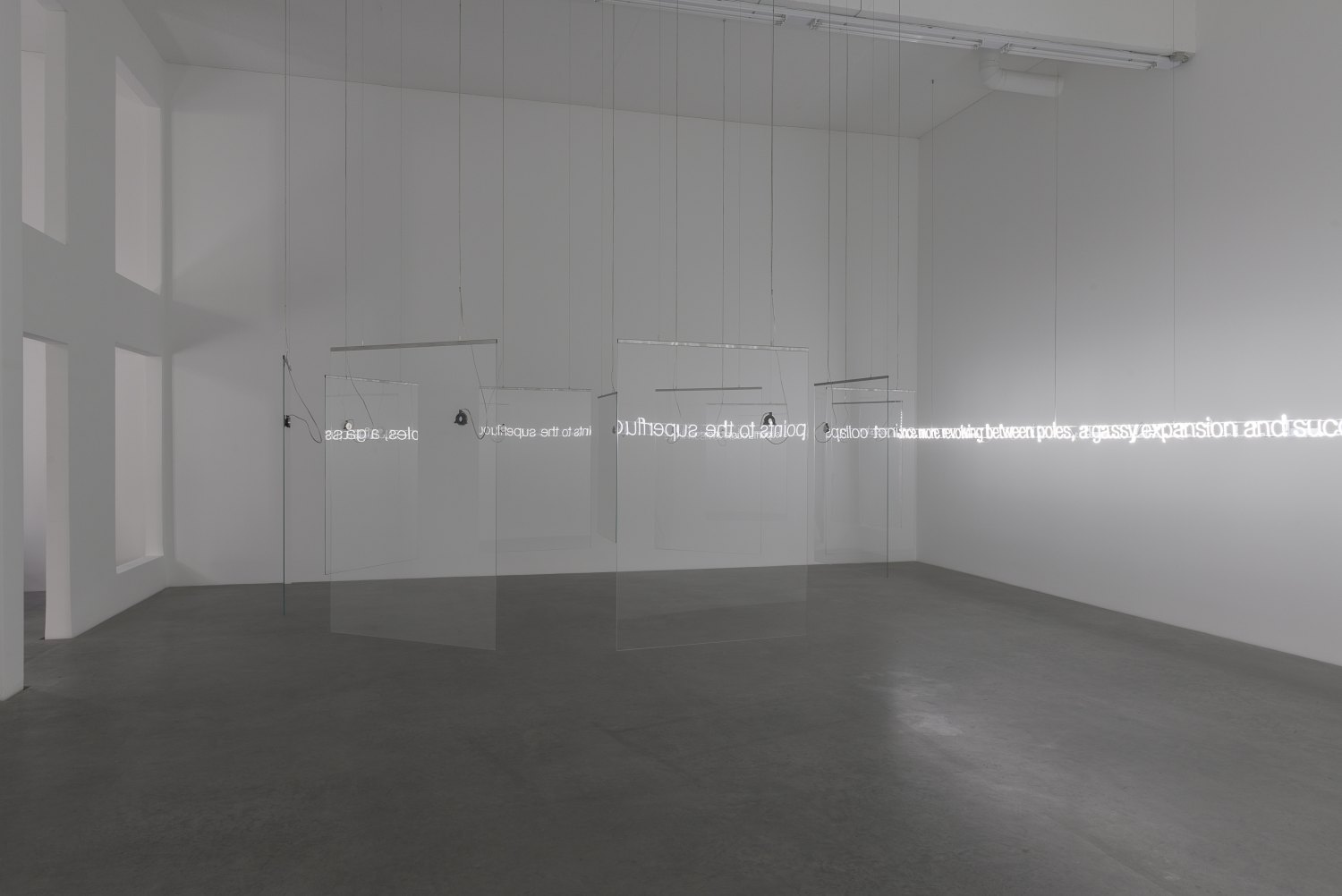 Cerith Wyn Evans 'E=L=A=P=S=E' in Glass with sound, 2016 (installation view) 11 pieces toughened low iron glass, 5 channel audio, 11 speakers, 3 amplifiers, 1 WavePlayer8, clear audio wire, 1mm stainless steel cable 196 x 520 x 470 cm 