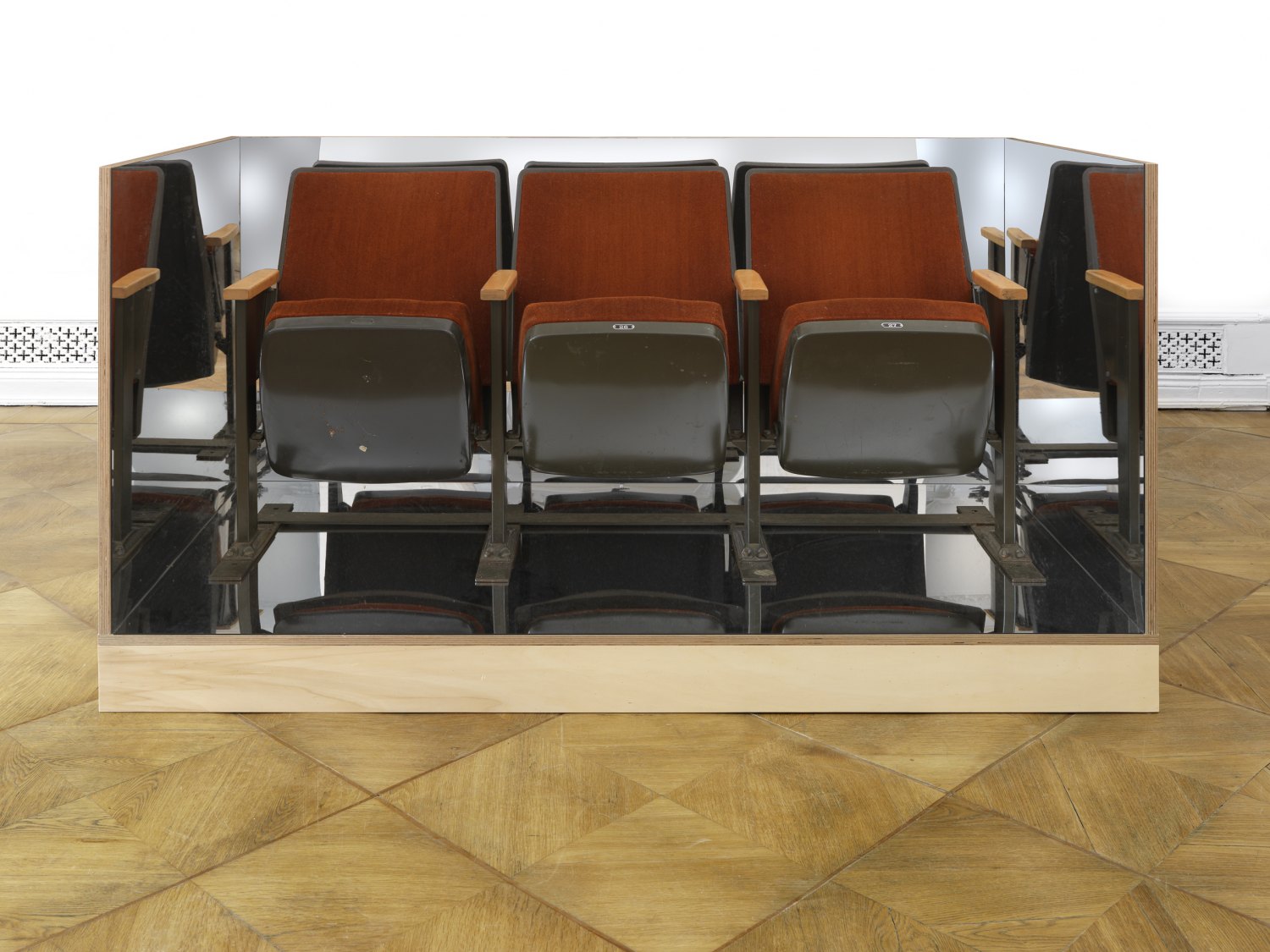 Tom Burr Three Seats in a Box, 2010 Plywood, mirrored plexiglas, carpet, movie theater seats, 107 × 183 × 91.5 cm 