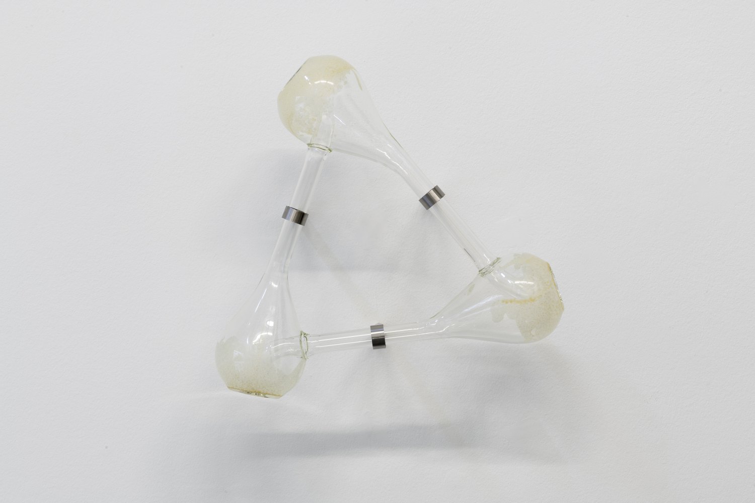 Jeremy Shaw Innumerable Thresholds Remain Available to You Without End, 2026 Flame-worked Borosilicate glass, vaporized freebase dimethyltrypamine (DMT) residue, stainless steel 43.5 x 44.5 x 20.5 cm