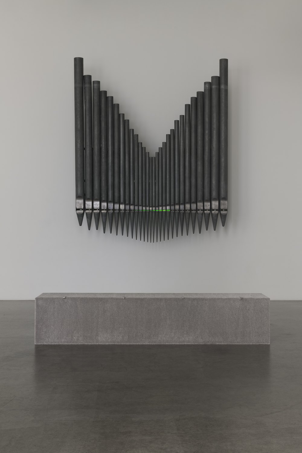 Jeremy Shaw&nbsp; Half-Life of Grace (1958), 2026&nbsp; 28 decommissioned zinc-based metal alloy church organ pipes, hand-blown uranium glass, ultra violet (UV) lights, electronic circuitry, transducer speakers, audio, stainless steel 300 x 255 x 58 cm&nbsp;
