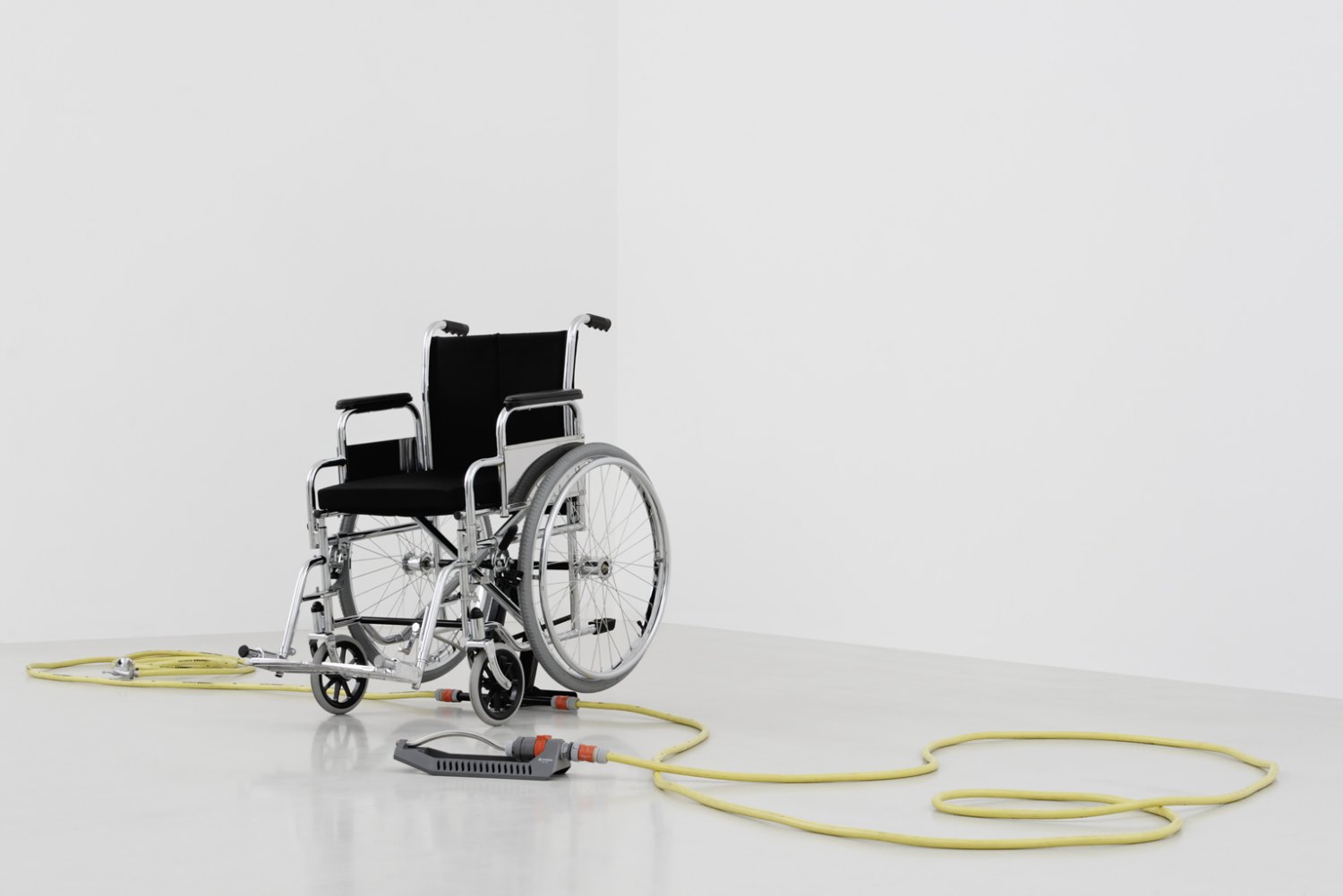 Andreas Slominski Untitled, 2000 Wheelchair, garden hose, sprinkler, plastic, metal, 112 × 66 × 96 cm